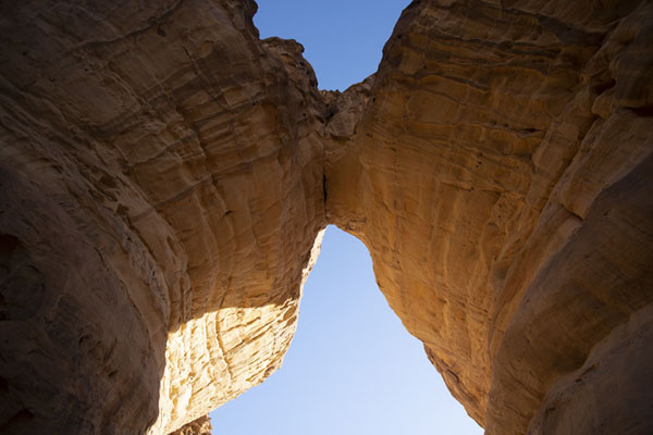 Looking up a natural bridge in a rock | Al Ula rock formations | Saudi Arabia