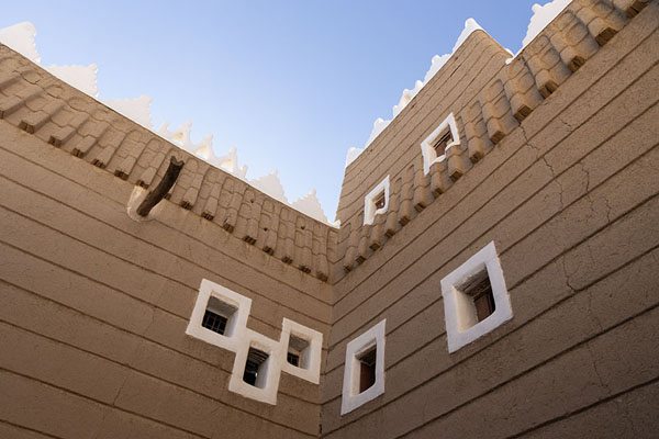 Looking up a corner with white-painted windows in Emara Palace | Emara Palace | Saudi Arabia