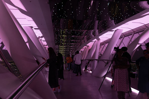 Picture of The Sky Bridge is lit with violet light allowing people to watch Riyadh below - Saudi Arabia - Asia