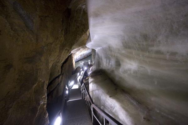 Trail surrounded by rocks and ice | Dobšinska Ice Cave | Slovakia
