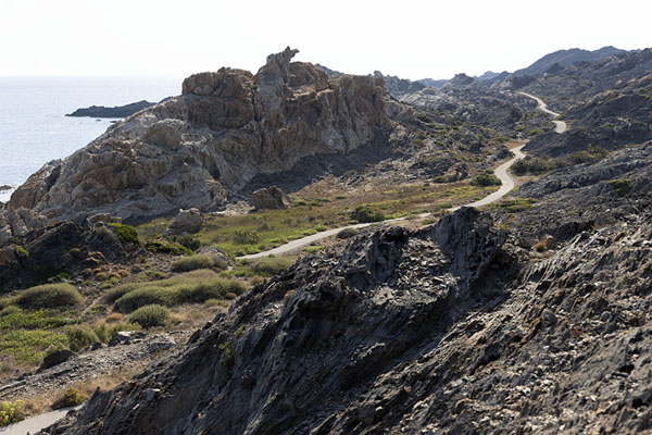 Trail meandering through the landscape of Cap de Creus natural park | Cap de Creus natural park | Spain