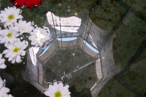 Cupola of Arab baths reflected in pond | Girona | Spain