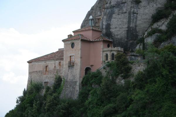 Picture of Santa Cova chapel in Montserrat area clinging to the steep cliffs