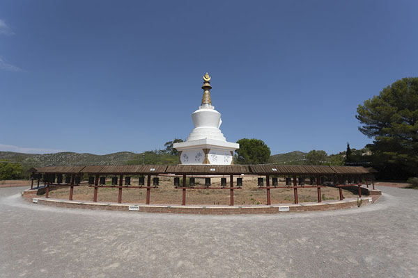 Foto di Prayer wheels surrounding the chorten of Sakya Tashi Ling monasterySakya Tashi Ling - Spagna
