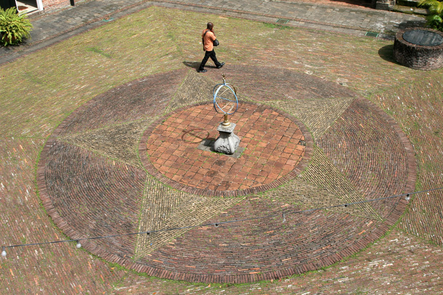 Person walking on the small square inside Fort Zeelandia | Fort Zeelandia | Surinam
