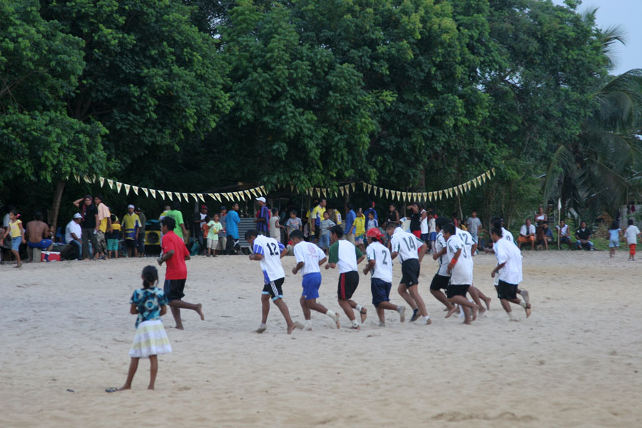A local football team doing warm-ups during half time | Galibi | le Surinam