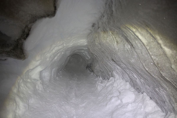 Tunnel through the snow at the entrance of the ice cave | Sarkofagen and ice cave hike | Svalbard and Jan Mayen