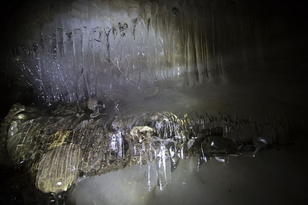 Ice covering rocks inside the glacier | Sarkofagen and ice cave hike | Svalbard and Jan Mayen