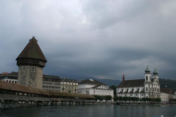 Picture of Dark skies looming over Lucerne: the Chapel bridge and the watertowerLucerne - Switzerland