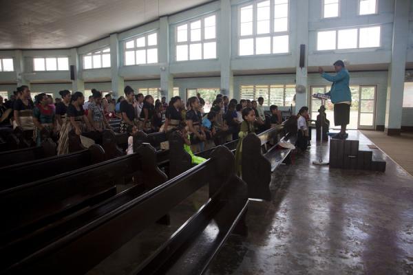Man directing the choir during service in a Wesleyan church in Neiafu | Tongan church services | Tonga