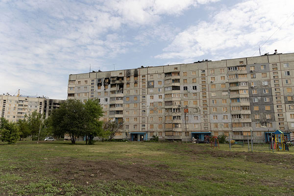 Foto van War damage can be see in every single apartment block in SaltivkaKharkiv - Oekraïne