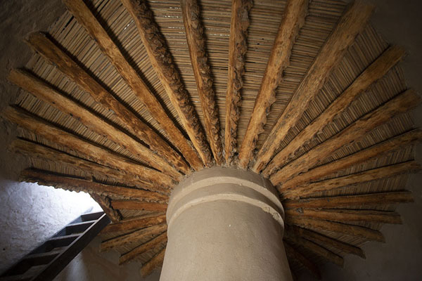 Picture of Looking up the tower of Wahla Fort with palm tree beamsWahla - United Arab Emirates