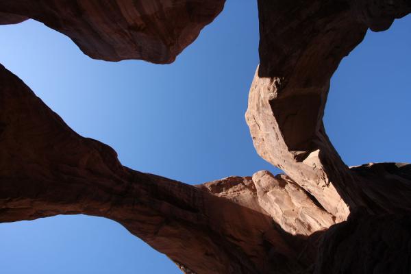 Looking up to the sky from inside Double Arch | Arches National Park | United States