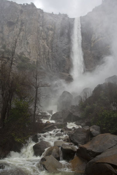 Picture of Yosemite waterfalls (United States): Bridalveil fall with spray and raging river in the valley