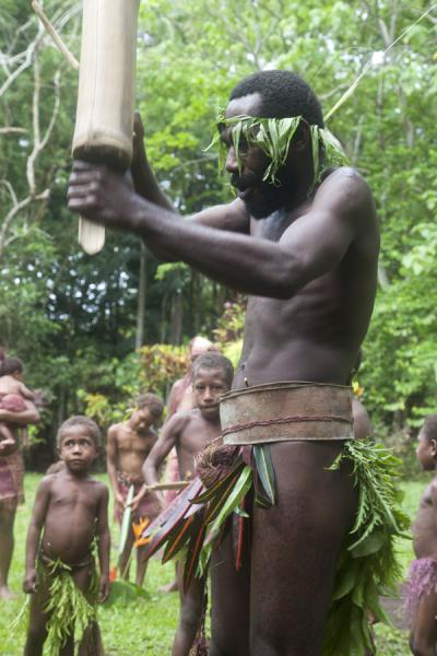 Picture of Big Namba singing with a small tam-tamMae - Vanuatu