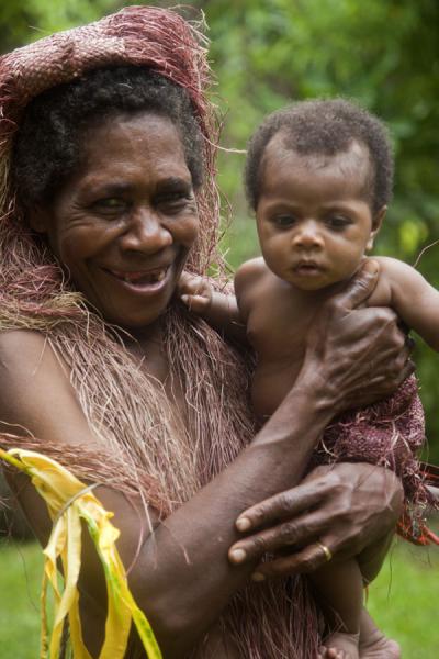 Picture of Mae Big Namba's (Vanuatu): Old Big Namba woman with tradiitonal hair dress and kid on her arm