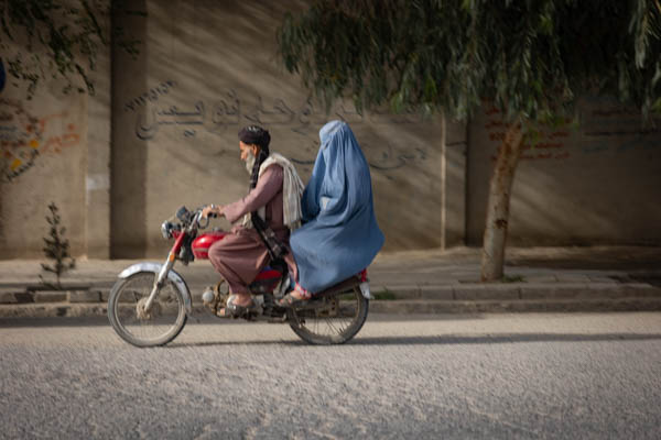 Man and woman on a motorbike in Kandahar, Afghanistan
