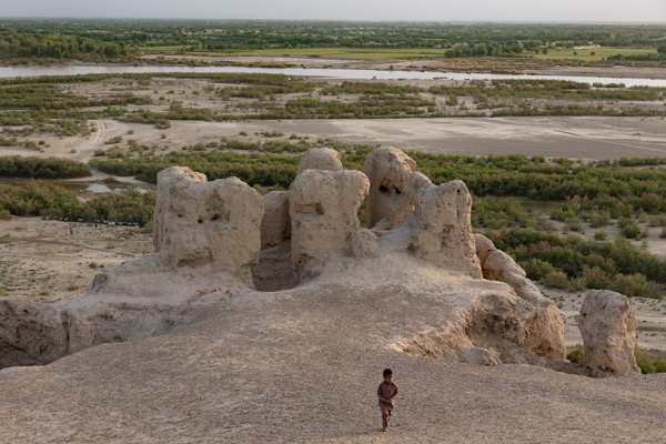 Picture of Boy running on the ruins of the Fort of BostLashkargah - Afghanistan