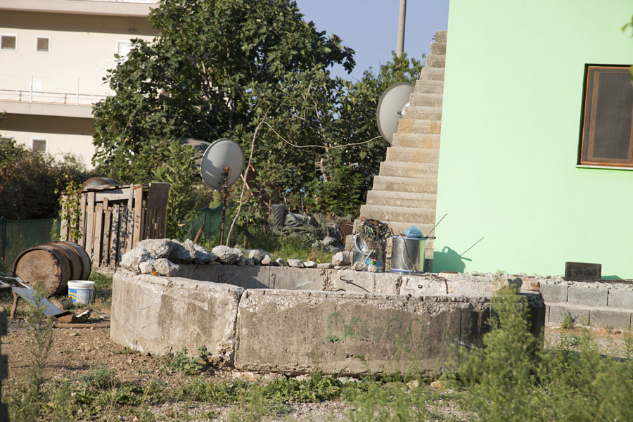 In this garden, only the lower part of the bunker remains, Albania