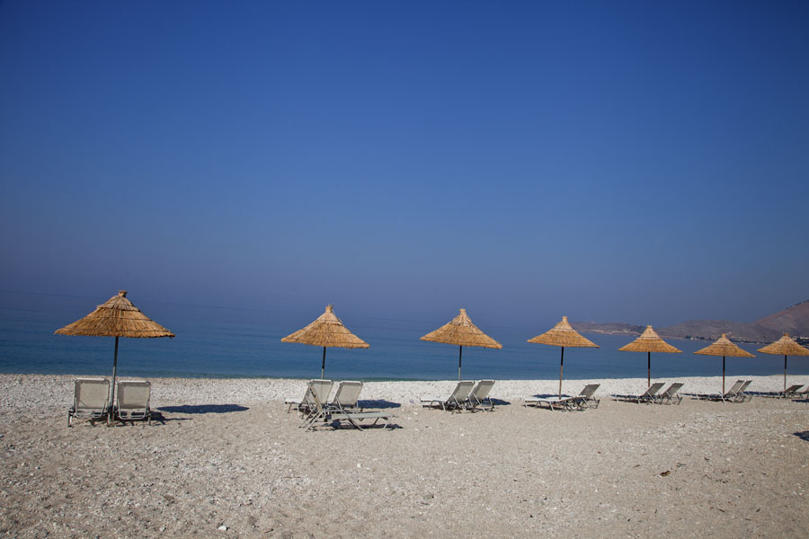 Parasols on the beach once full of bunkers, Albania
