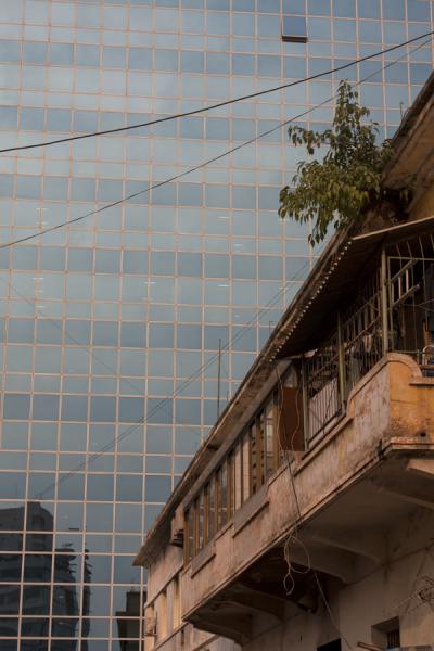 Old colonial building next to modern concrete structure, Angola