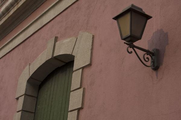 Lantern, window and wall of a colonial building in Baixa Luanda, Angola