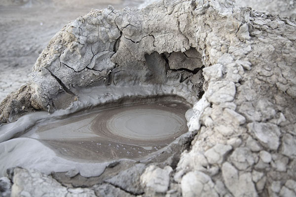 Foto di Tiny crater of a mud volcano with crusted mudGobustan - Azerbaigian
