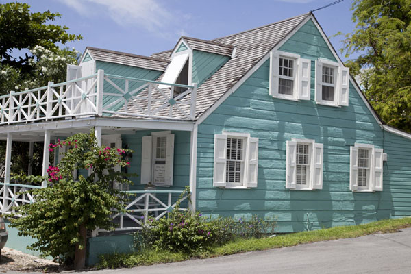 Side view of a wooden house in Dunmore Town painted green | Dunmore Town | Bahamas