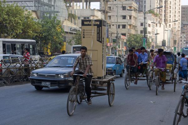 Man taking his new fridge home - on his bike, Bangladesh
