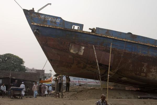 Workers and a ship in the shipyard of Dhaka, Bangladesh