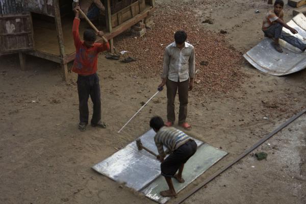 Working hard on a part of a ship, Bangladesh