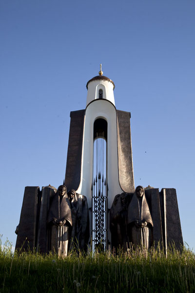 The chapel surrounded by statues of weeping women on the Island of Tears, Belarus