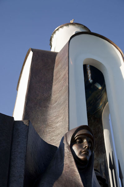 Looking up the chapel with one of the wailing women, Belarus
