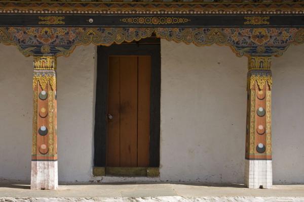 Two wooden columns and door inside Punakha Dzong | Punakha Dzong | Bhutan