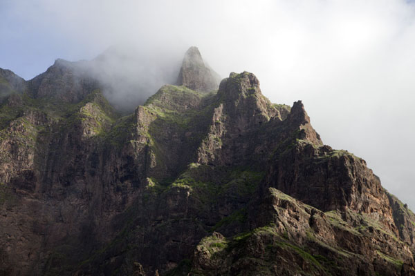 Clouds whirling around the peaks of a mountain range above Coculi, Cabo Verde