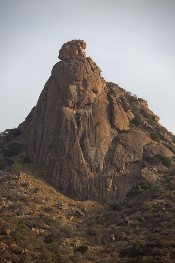 Looking up a steep rocky mountain at the Ab Touyour range | Ab Touyour | Chad