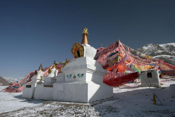 Stupas and prayer flags of Batang sky burial site, China