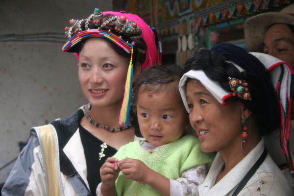 Family in traditional Tibetan village, China