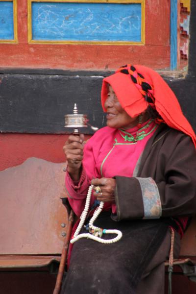 Traditional Khampa woman outside Tagong monastery, China