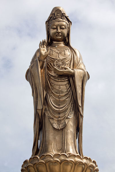 Frontal view of the golden statue of Guanyin near the south tip of Putuoshan | Putuoshan | China