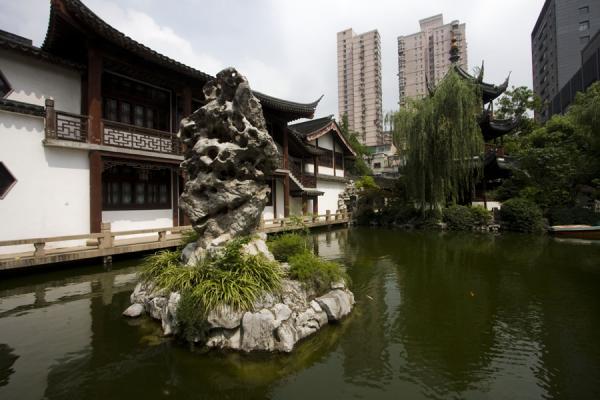 Reflection Pond with rocky islet and hall in the background, Confucian Temple, China