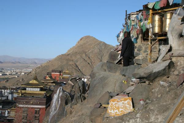 View over Tashilhunpo monastery and beyond, China Pilgrim looking over Tashilhunpo monastery and beyond, China