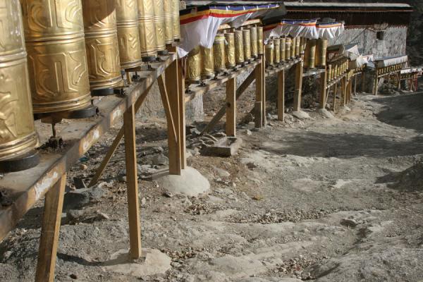 Path for pilgrims: prayer wheels marking the kora around Tashilhunpo monastery, China