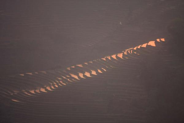 Last sunlight falling on the rice terraces at the Tiger Mouth, Yuanyang rice terraces, China