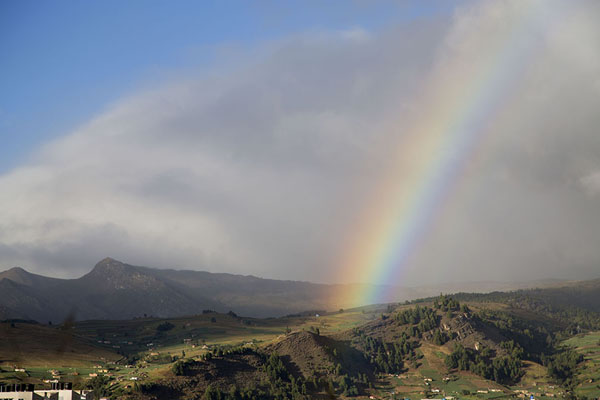 Rainbow over the landscape surrounding Lake Tota, Colombia