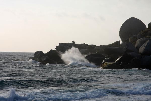 Waves crashing on the enormous boulders near Cabo San Juan de la GuĂa, Colombia Waves crashing against the boulders near Cabo San Juan de la GuĂa, Colombia