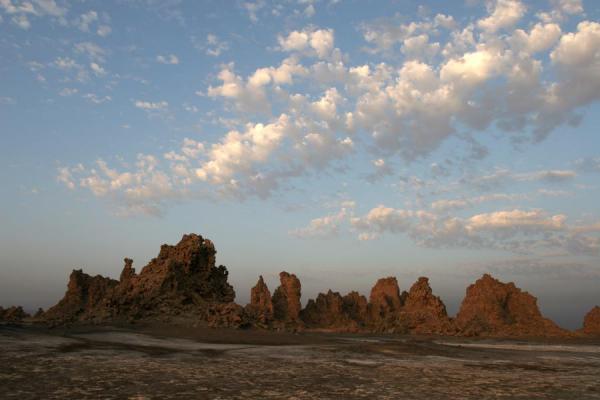 Chimneys and clouds of Lac Abbé appearing after sunrise | Lac AbbÃ© | Yibuti