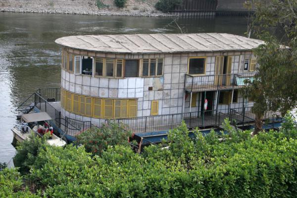Houseboat with two stories on the river Nile in Cairo, Egypt Two-storied houseboat or dahabiyyah on the river Nile in Cairo, Egypt
