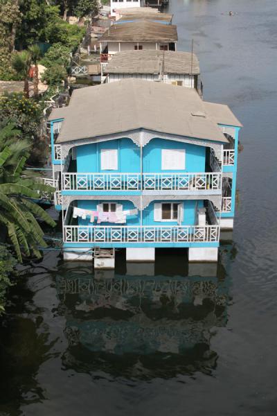 Blue and white houseboat on the river Nile, Egypt