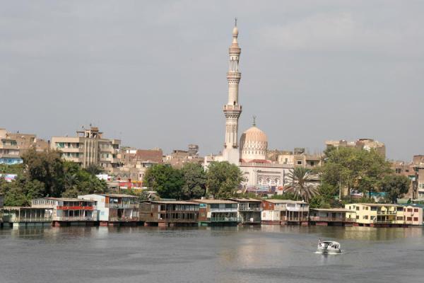 Houseboats and Kit Kat mosque with river Nile, Egypt
